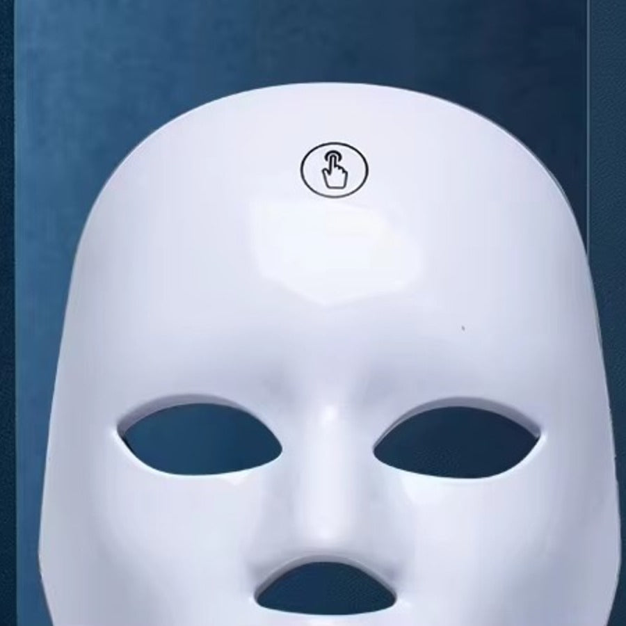 Close-up of the one-touch control button on the Lumière LED mask